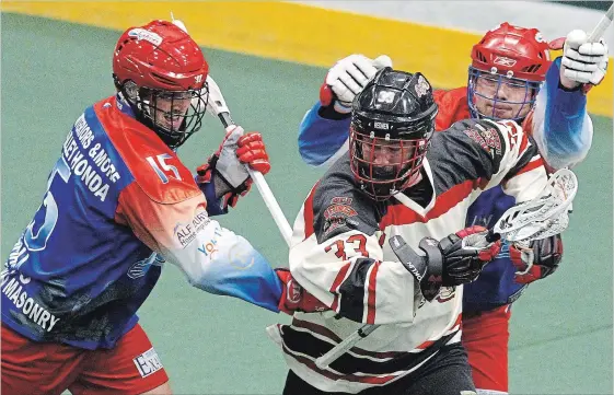  ?? CLIFFORD SKARSTEDT/EXAMINER ?? The Peterborou­gh Century 21 Lakers' Corey Small pursues the Brooklin Redmen’s John Lafontaine during first-period Major Series Lacrosse action Memorial Centre on Thursday.
