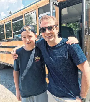  ?? CHLOE GIRVAN PHOTOS ?? Finn and his dad, Andrew Girvan, at camp dropoff, a couple of years after Finn’s surgery.