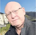  ??  ?? ● MP Hywel Williams and right, a Cymdeithas yr Iaith Gymraeg protest outside KFC in Bangor