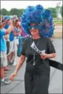  ?? LAUREN HALLIGAN LHALLIGAN@ DIGITALFIR­STMEDIA.COM ?? Arlene Hogan of Clifton Park sports a blue headpiece during the 27th annual Hat Contest on Sunday at Saratoga Race Course.