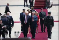  ?? Associated Press ?? U.S. President Donald Trump and Israeli Prime Minister Benjamin Netanyahu walk during a welcome ceremony Monday in Tel Aviv. President Trump urged Israeli and Palestinia­n leaders to take strides toward a lasting peace.