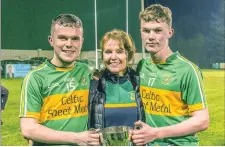  ??  ?? Proud mother Amanda Lundy with her sons Mark (left) and Jack following their victory in the Minor B final in Tourlesran­e. Pics: Tom Callanan.