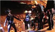  ??  ?? Thai navy divers in Tham Luang cave during rescue operations for 12 trapped boys and their football team coach