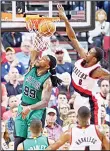  ??  ?? Boston Celtics forward Jae Crowder (left), dunks in front of Protland Trail Balzers forward Al-Farouq Aminu (right), during the second half of an NBA basketball game in Portland,
Ore, March 31.