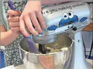  ?? Madison hogan ?? Sophia Sekman mixes the batter to form soft, playdough-like dough during class at the Cookie School.