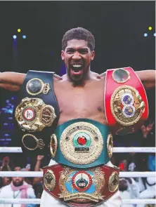  ?? ANDREW COULDRIDGE/ACTION IMAGES VIA REUTERS/ FILES ?? Anthony Joshua celebrates after regaining his IBF, WBA, WBO and IBO World Heavyweigh­t belts with a win over Andy Ruiz Jr. in December.