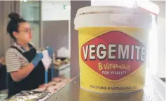  ??  ?? A tub of Vegemite is seen at a local cafeteria in Melbourne, Australia. Vegemite, the salty yeast-based spread beloved by Australian­s, is returning Down Under after decades of US ownership. — Reuters photo