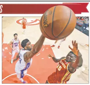  ?? Getty Images ?? GET OUT OF HERE! Joel Embiid blocks Clint Capela’s shot during the second half of the 76ers’ 127-111 victory over the Hawks on Friday.