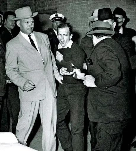  ??  ?? YOU DON’T KNOW
JACK: Ruby, right, who killed Oswald, center, is mentioned 199 times in the archives, mostly in IRS records.