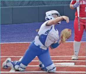  ?? TONY LENAHAN/THE Saline Courier ?? Bryant senior Abby Gentry picks off a runner at first base from her knees in the Lady Hornets 8-5 win over Cabot Thursday at Farris Field.