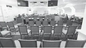  ?? KENNETH K. LAM/BALTIMORE SUN ?? Members of the Senate’s Executive Nomination committee hold a meeting March 15 to an empty hearing room with exception of four news reporters.