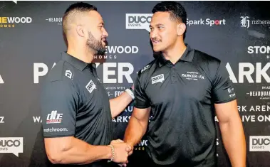 ??  ?? Joseph Parker and Junior Fa, seen here at an earlier event, passed their weigh-in yesterday before tonight’s clash.