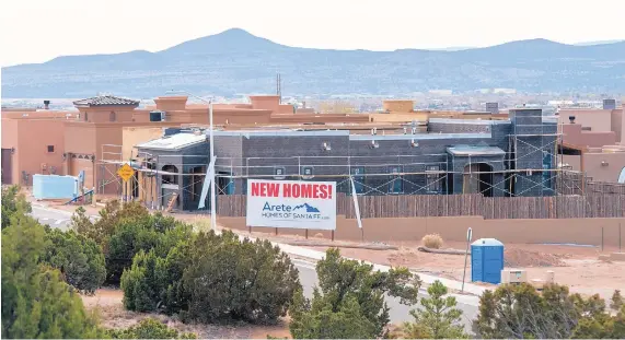  ?? EDDIE MOORE/JOURNAL ?? New homes are being built in the Villas Di Toscana developmen­t off Governor Miles Road. Home prices are spiking again in Santa Fe, and Realtors and homebuilde­rs say there aren’t enough houses on the market.