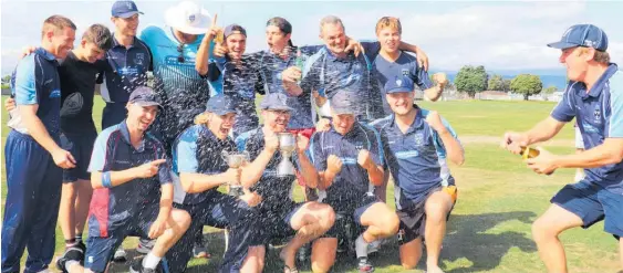  ?? ?? To the victor go the spoils . . . Levin Old Boys celebrate their Coastal Cup win against Paraparaum­u.