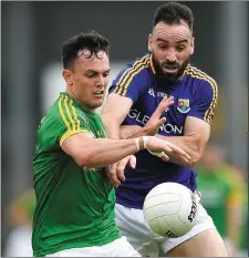  ??  ?? James McEntee in action against Diarmuid Masterson shortly before the Meath man’s sending-off.