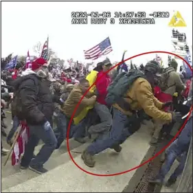  ?? DEPARTMENT OF JUSTICE VIA AP ?? This image — taken from video from a police officer’s body-worn camera — was annotated in the Justice Department’s memo supporting the sentencing of Jeffrey Sabol. It shows Sabol at the Capitol on Jan. 6, 2021, in Washington. During the course of an attack on police officers, Sabol ripped the baton out of the hands of a fallen officer, leaving him unable to defend himself against assaults by other rioters. Sabol then helped his codefendan­ts drag a second officer into the crowd, where that officer also was beaten by rioters.