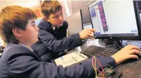  ??  ?? ●●From left, Oscar Longstaff and Bradley Kneen at the new Robotics Club