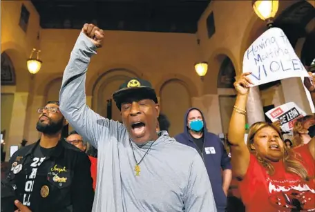  ?? Carolyn Cole Los Angeles Times ?? PETE WHITE, center, and Kenia Alcocer, right, join others last month in demanding that some members of the L.A. City Council resign.