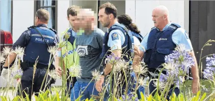  ?? PHOTOS: STEPHEN JAQUIERY ?? Apprehende­d . . . A man is led away from a Taieri Mouth house by police following a machete attack.