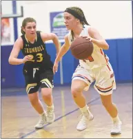  ?? H John Voorhees III / Hearst Connecticu­t Media ?? Danbury’s Susana Almeida, right, drives by Trumbull’s Julie Keckler in a game last season at Danbury.