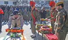  ?? — PTI ?? Senior officer of J&amp; K police pay tribute to head constable Mushtaq Ahmad during the wreath- laying ceremony in Srinagar on Tuesday.