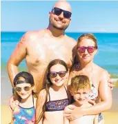  ?? COURTESY ?? Doug and Brooke Rathell, of Arnold, seen with their children on vacation in Ocean City, were the first to provide medical aid to a 12-year-old girl who was bitten by a shark Monday.