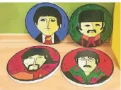  ??  ?? Gabi Koepp hat die vier Beatles-Mitglieder gemalt. Die Holzplatte­n gehören zu einem großen Gemälde, das kurz vor der Eröffnung noch nicht fertig war.