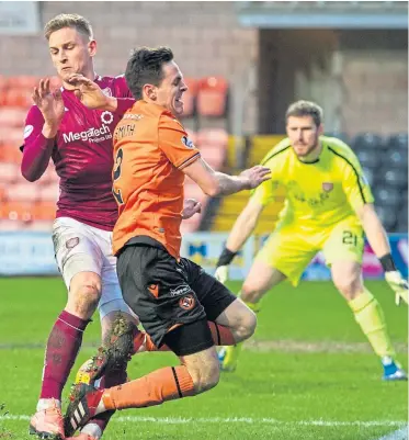  ?? SNS. Pictures: ?? Left: Arbroath’s Craig Wighton, far left, celebrates with team-mates after scoring the winning goal against Dundee United at Tannadice; right: The Lichties’ Thomas O’Brien tackles United’s Liam Smith.