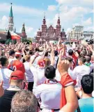  ??  ?? Riot of colour: The masses in Moscow’s Red Square hail their victorious team