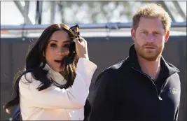  ?? PETER DEJONG — THE ASSOCIATED PRESS FILE ?? Prince Harry and Meghan Markle, Duke and Duchess of Sussex visit the track and field event at the Invictus Games in The Hague, Netherland­s, on April 17, 2022. A spokespers­on says the couple were involved in a car chase while being followed by photograph­ers.