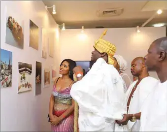  ??  ?? L-R: Founder and Creative Director, Art X, Tokini Peterside and Ooni of Ife at the 2018 ART X exhibition, Lagos
