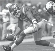  ?? NWA Democrat-Gazette/J.T. WAMPLER ?? Arkansas' Jared Cornelius on Saturday in Fayettevil­le. (center) bobbles a pass against TCU