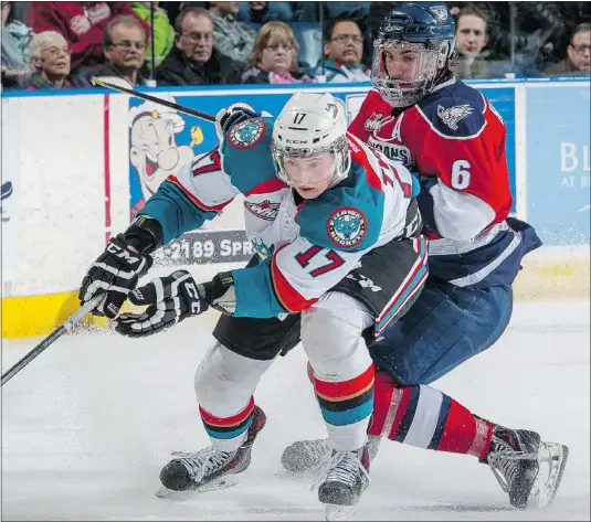  ?? — GETTY IMAGES FILES ?? Marek Tvrdon of the Kelowna Rockets is checked by the Tri-City Americans’ Justin Hamonic Feb. 19 in Kelowna. The Giants play there Friday and host the Rockets Saturday, with Tvrdon returning to the city where he played three years.
