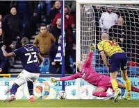  ?? ?? BIG BEN STRIKES Millwall’s Afobe seals the three points