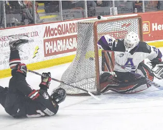  ?? TRURO NEWS PHOTO ?? Ben Higgins of the Truro Bearcats managed to lift the puck over Amherst netminder Matthew Normore during second-period action Saturday night. The Bearcats improved their standing in the MHL’S south division with a 5-1 victory over the Ramblers.