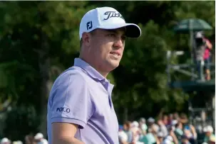  ?? AP file ?? Justin Thomas won his first major with a thrilling two-shot victory at the US PGA Championsh­ip at Quail Hollow. He trailed leader Kevin Kisner by two shots going into the final round. —