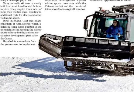  ?? ?? A worker smooths a ski track at Genting Resort Secret Garden.