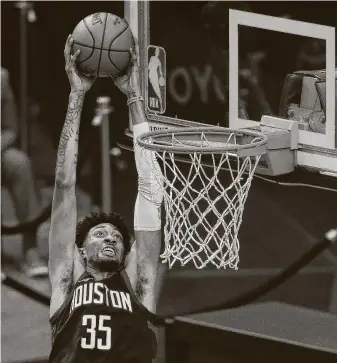  ?? Yi-Chin Lee / Staff photograph­er ?? ChristianW­ood (35) said he “circled on the calendar” the Rockets’ games against Anthony Davis and the defending NBA champion Lakers and is looking forward to the big-man matchup.