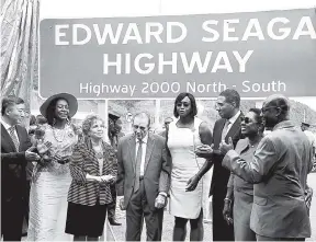  ?? FILE ?? Former Prime Minister Edward Seaga (fourth left) poses with Prime Minister Andrew Holness (third right) shortly after the naming of the North-South leg of Highway 2000 in Seaga’s honour on June 12. Sharing in the moment are (from left) Tian Qi, Chinese...