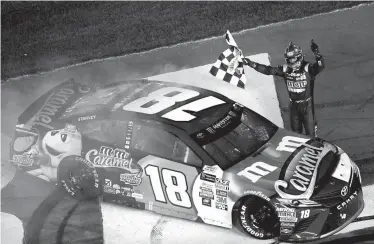  ?? Associated Press ?? Kyle Busch celebrates Saturday after winning the NASCAR All-Star auto race at the Charlotte Motor Speedway in Concord, N.C.