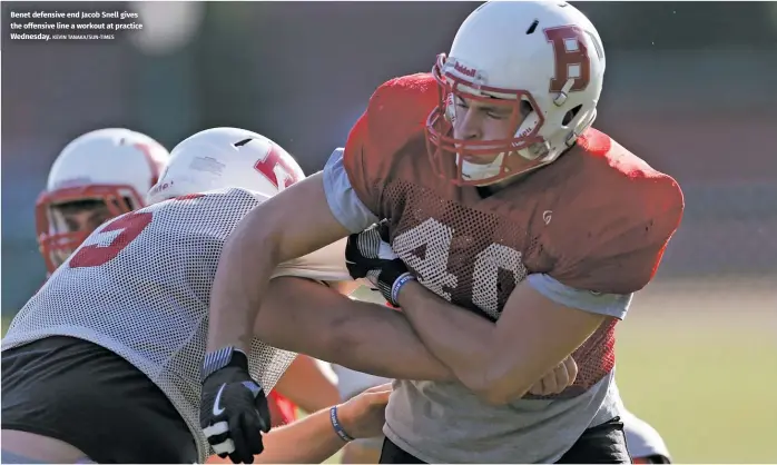 ?? KEVIN TANAKA/SUN-TIMES ?? Benet defensive end Jacob Snell gives the offensive line a workout at practice Wednesday.