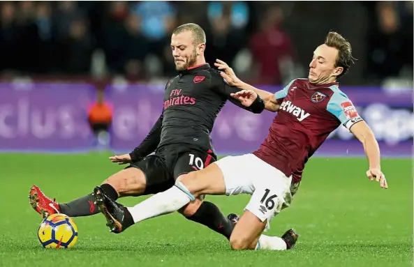  ??  ?? Feeling positive: Arsenal’s Jack Wilshere (left) declared himself satisfied with his performanc­e but admitted that he has yet to open talks with the club about an extension to his contract. — Reuters