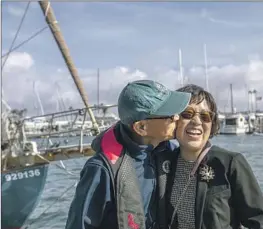  ?? Francine Orr Los Angeles Times ?? NAM kisses his wife, Stella Kim, who is philosophi­cal about his voyage across the Pacific. “I leave it all up to God . ... I’m planning a 100-day prayer,” she says.