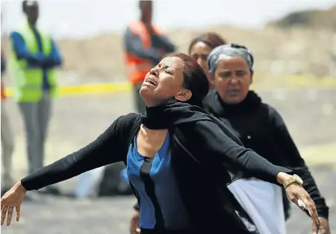  ?? Pictures: Reuters ?? NO SURVIVORS A relative of one of those who perished grieves at the scene of the crash of Ethiopian Airlines flight ET 302 near Addis Ababa, Ethiopia.