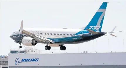  ??  ?? A Boeing 737 MAX jet lands following a Federal Aviation Administra­tion (FAA) test flight at Boeing Field in Seattle, Washington on June 29.