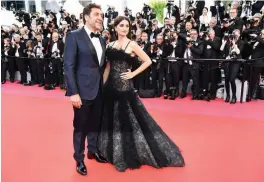  ??  ?? Spanish actor Javier Bardem (left) and Spanish actress Penelope Cruz pose as they arrive for the screening of the film “Todos Lo Saben (Everybody Knows)” and the opening ceremony of the 71st edition of the Cannes Film Festival in Cannes, southern...