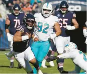  ?? NAM Y. HUH/AP ?? Justin Fields runs with the ball against the Miami Dolphins.