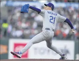  ?? TONY AVELAR — THE ASSOCIATED PRESS ?? Dodgers starter Walker Buehler pitched seven shutout innings against the Giants on Wednesday night, allowing just three hits while striking out eight in the 8-0victory.