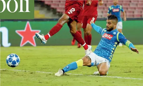  ?? (Reuters) ?? Guizzo Minuto 90, la partita svolta: Lorenzo Insigne, 27 anni, riceve palla da Callejon dalla destra e in scivolata supera Alisson