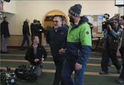  ?? JACQUES BOISSINOT, THE CANADIAN PRESS ?? Mosque vice-president Mohamed Labidi, left, says he wanted to open the centre to the public so people can see what worshipper­s had to suffer.